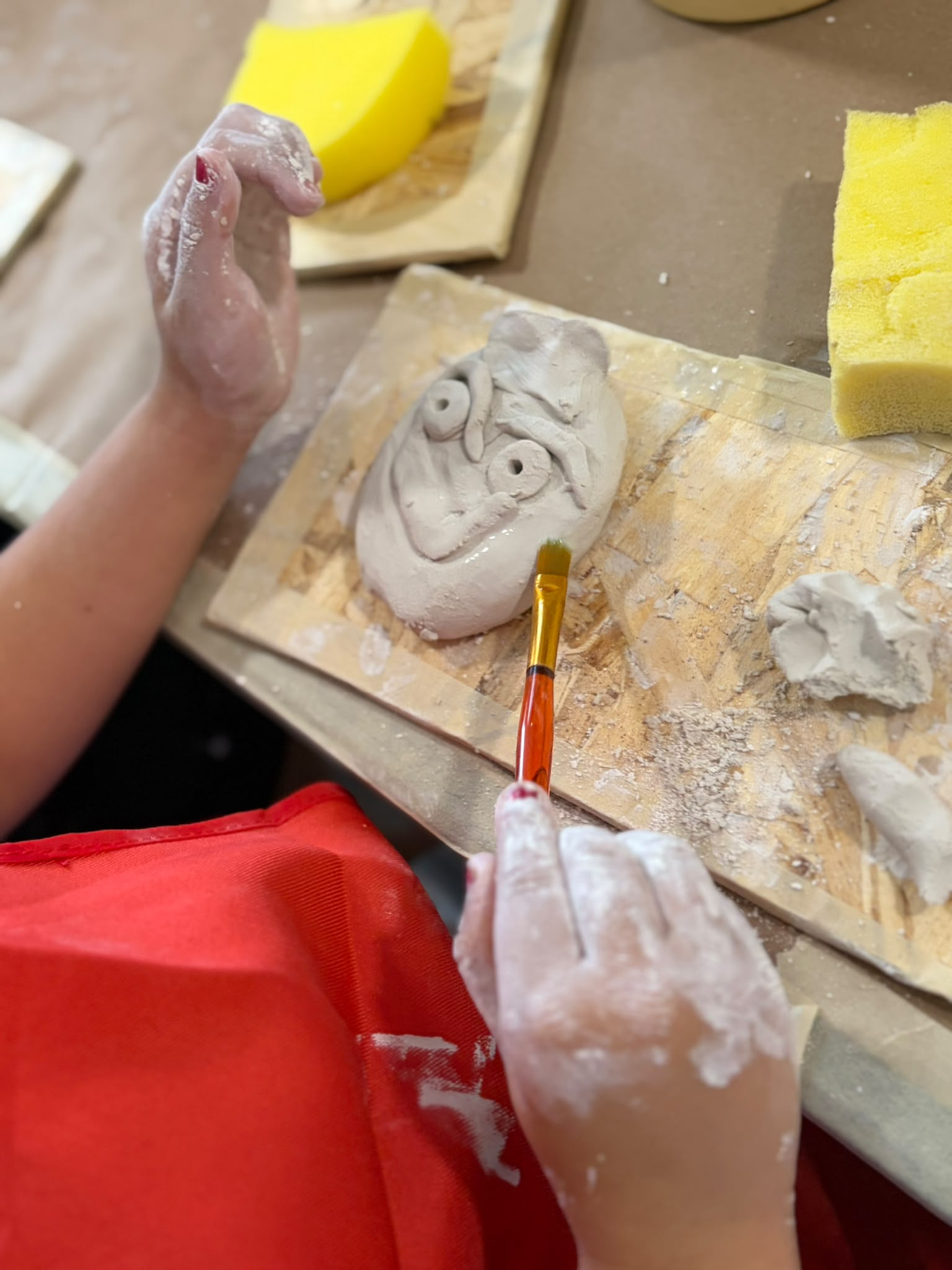 Kids working with clay